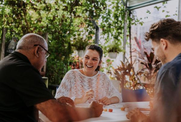 Couple learning about Aboriginal culture through painting and storytelling at Janbal Gallery, Down Under Tours - Daintree Dreaming, Mossman Gorge, Queensland © Tourism and Events Queensland