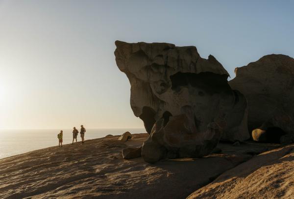 Group of people admiring the Remarkable Rocks and seascape on Flinders Chase National Park, Kangaroo Island, South Australia © Tourism Australia