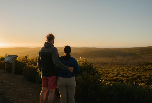 Couple looking out at the sunset across Flinders Chase National Park, Kangaroo Island, South Australia © Tourism Australia