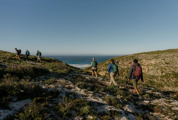 Group of hikers traversing sand dunes on the coast of Flinders Chase National Park, Kangaroo Island, South Australia © Tourism Australia