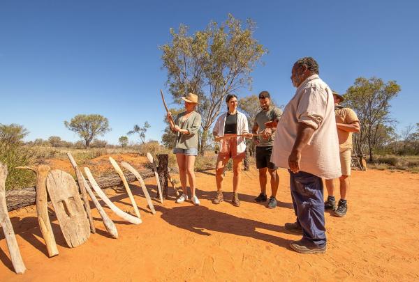 Guide showing a tour artefacts, Karrke Aboriginal Cultural Experience & Tours, Red Centre, Northern Territory © Tourism Australia