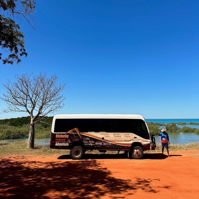 Robert Dann and the KCA van on the red dirt under an incredible blue sky, Kimberley Cultural Adventures, Broome, Western Australia © Tourism Australia