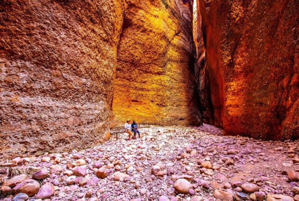 Two people admiring the Echidna Chasm, Kimberley, Western Australia © Tourism Australia