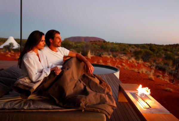 Fireside drinks at Longitude 131° with Uluru in the background, Yulara, Northern Territory © Bailie Lodges