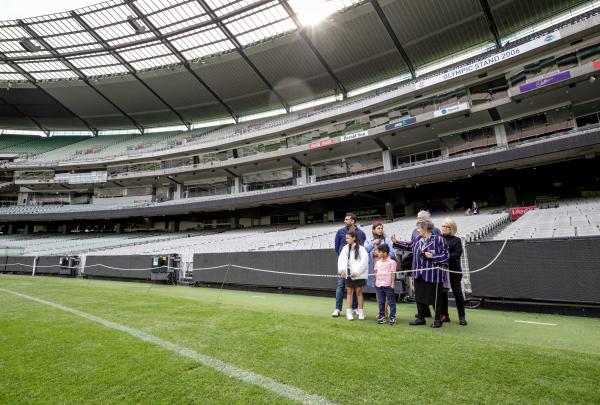 Family enjoying a tour of the grounds of the Melbourne Cricket Ground, East Melbourne, Melbourne, Victoria © Tourism Australia