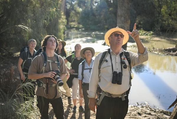 A tour guide takes a group of people on a walk through the river landscape of Renmark, South Australia © Tourism Australia