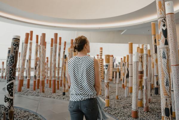A woman viewing Indigenous artwork at the National Gallery of Australia, Canberra, Australian Capital Territory © Tourism Australia