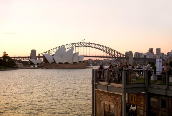 View of the Handa Opera on Sydney Harbour bar, with the Sydney Harbour Bridge and Sydney Opera House in the background, Sydney, New South Wales © Tourism Australia