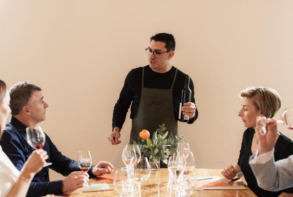 Group enjoying a wine tasting at Pizzini Wines, Whitfield, King Valley, Victoria © Tourism Australia