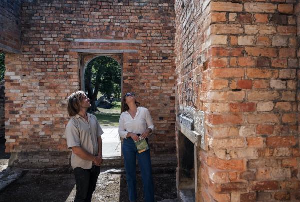 Couple exploring the interior of a historic building at Port Arthur Historic Site, Port Arthur, Tasmania © Tourism Australia