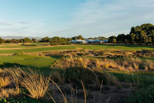 Golf course and clubhouse in the distance of Royal Adelaide Golf Club, Seaton, South Australia © Great Golf Courses of Australia