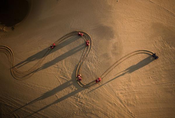 Quad bike riders on the sand dunes at Stockton Beach on a Sand Dune Adventures tour, Port Stephens, New South Wales © Tourism Australia