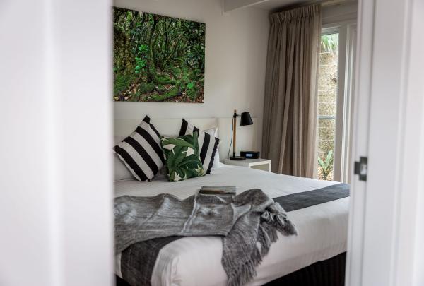 A cozy interior view of a coastal-styled room at Pinetrees Lodge, Seven Peaks Walk, Pinetrees Lodge, Lord Howe Island, New South Wales © Tourism Australia