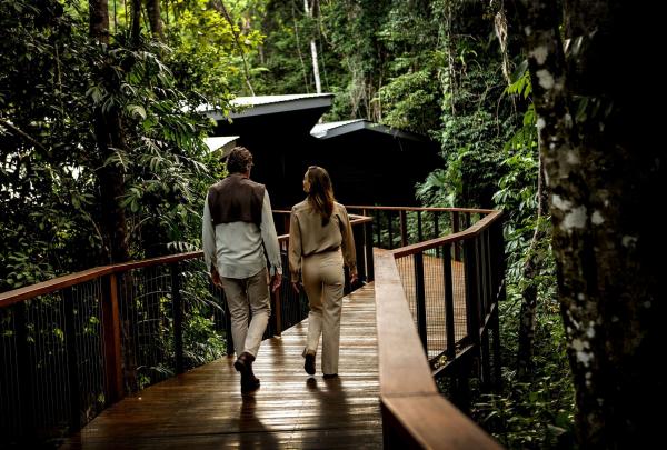 Couple on deck walk at Silky Oaks Lodge, Tropical North Queensland, Queensland © Tourism Australia