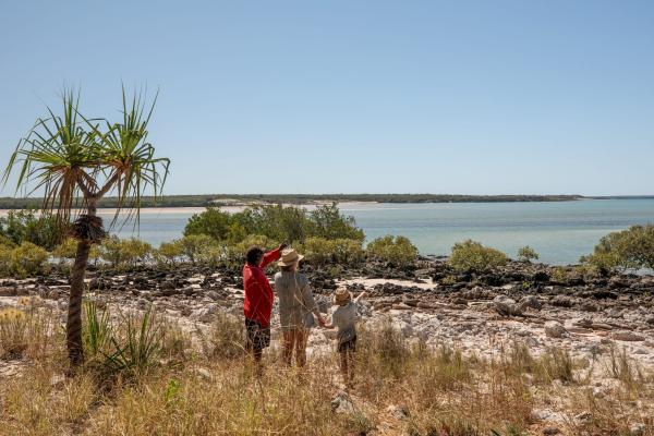 Mother and son with an Indigenous guide looking out over the water in Dampier Peninsula, Western Australia  © James Fisher Photography/Tourism Australia