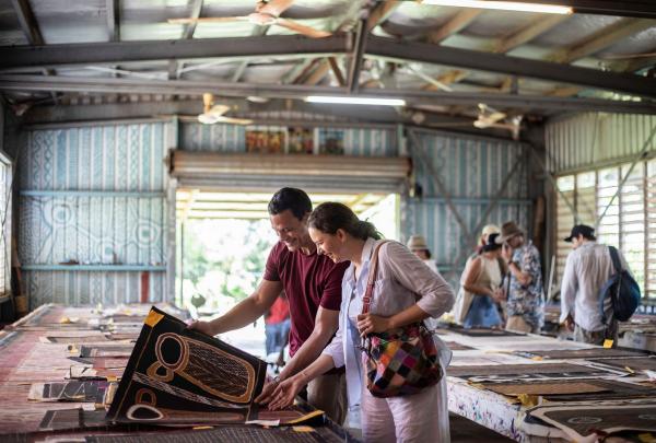 Couple at The Tiwi Islands Art Sale at Tiwi Design, Tiwi Tours, Wurrumiyanga, Bathurst Island, Northern Territory © Tourism NT