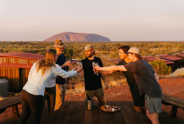 Group having celebration drinks at the accommodation, Uluṟu Kata Tjuṯa Signature Walk, Uluṟu Kata Tjuṯa National Park, Northern Territory © Tasmanian Walking Company