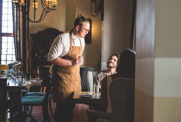 Chef Felix Kleenmann talking to guests at table at Voyager Estate, Stevens Valley, Margaret River, Western Australia © Voyager Estate