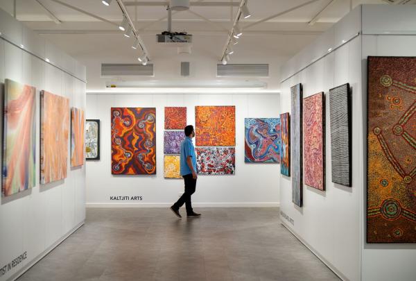 Man visiting the Gallery of Central Australia, Voyages Indigenous Tourism Australia - Ayers Rock Resort, Northern Territory © Tourism Australia