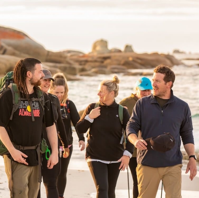 palawa guide Cody Gangell leads guests south along the coastline towards larapuna (Bay of Fires), Tasmania © Jillian Mundy & Tourism Australia