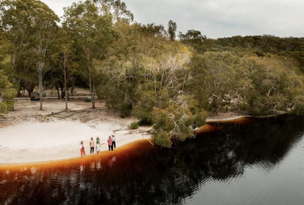 Ladies at Bromiera Lake on the Indigenous Tour, Yura Tours, Minjerribah/North Stradbroke Island, Queensland © Tourism Australia